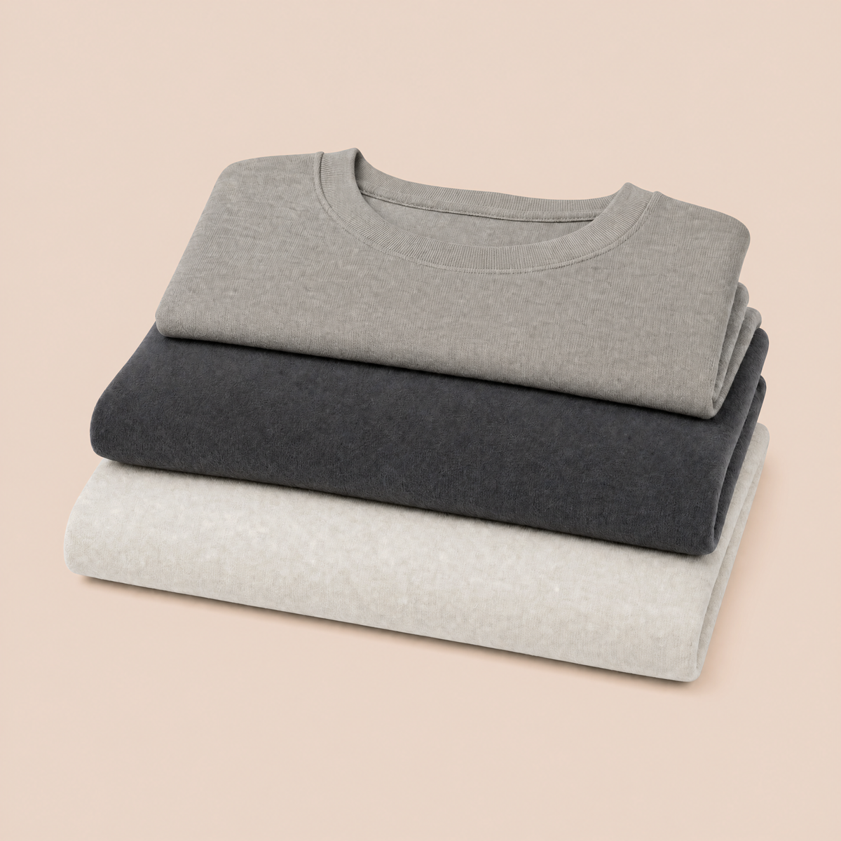 Pièces GOOD X HOOD posées à plat sur fond gris
